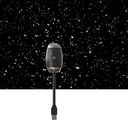 Black electronic device with power symbol on a black background with white dots