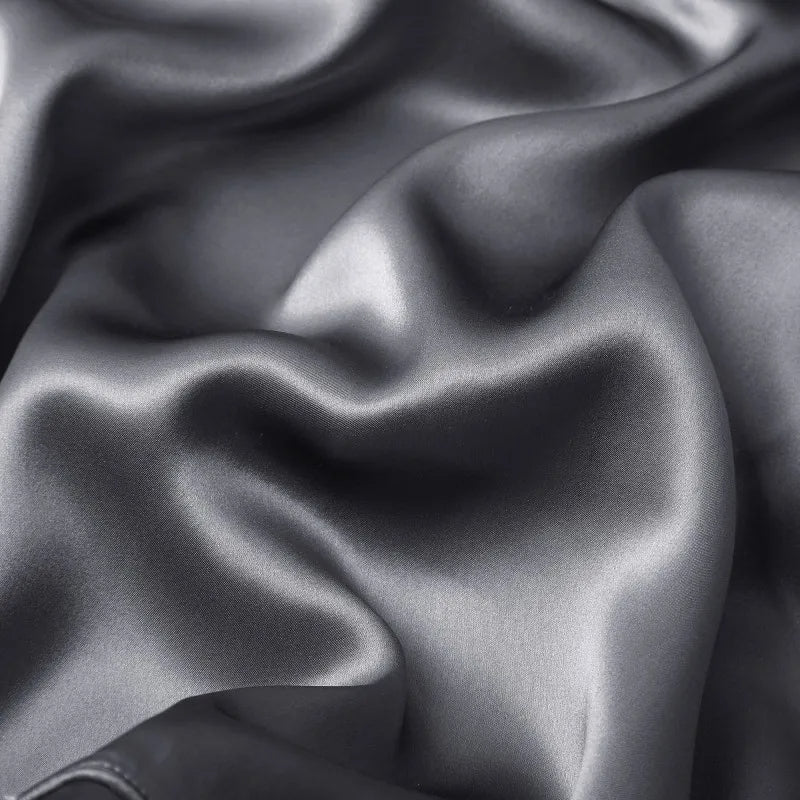Close-up of dark gray fabric with folds
