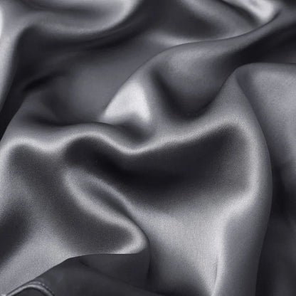 Close-up of dark gray fabric with folds