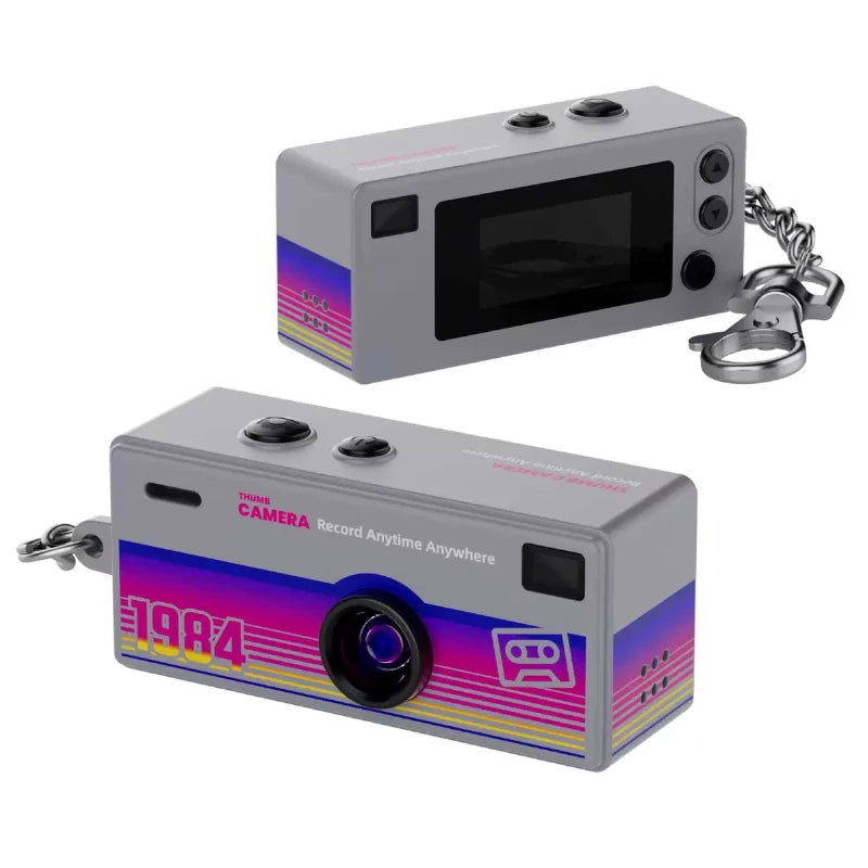 Two retro-style cameras with a keychain attached on a white background