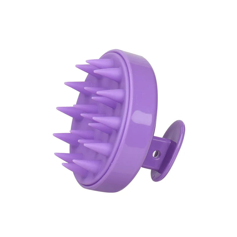 Purple scalp massager with spikes on a white background