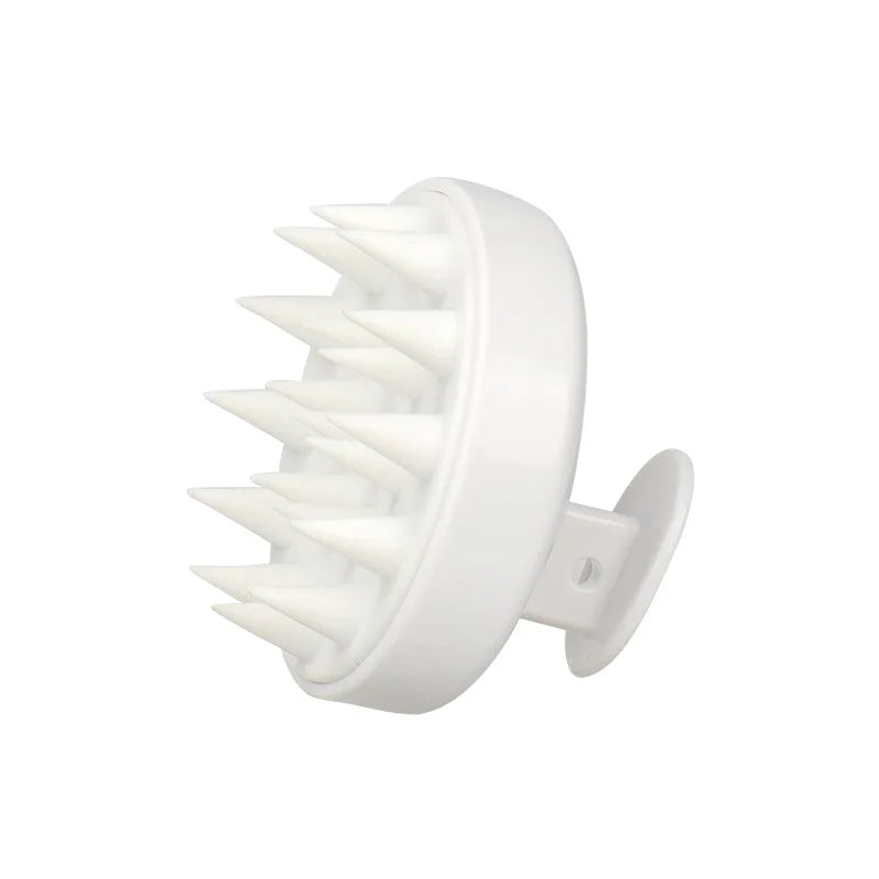 White scalp massager on a white background