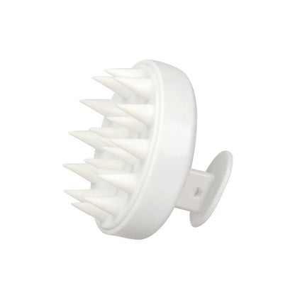White scalp massager on a white background