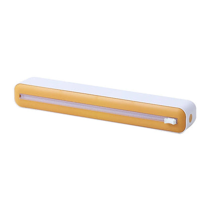 Rectangular light fixture with yellow body and white top on a white background