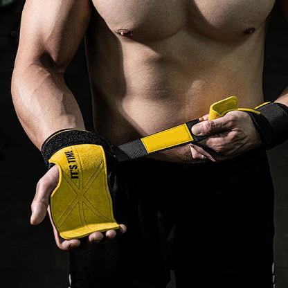 Person wearing yellow wrist wraps with black straps on a dark background