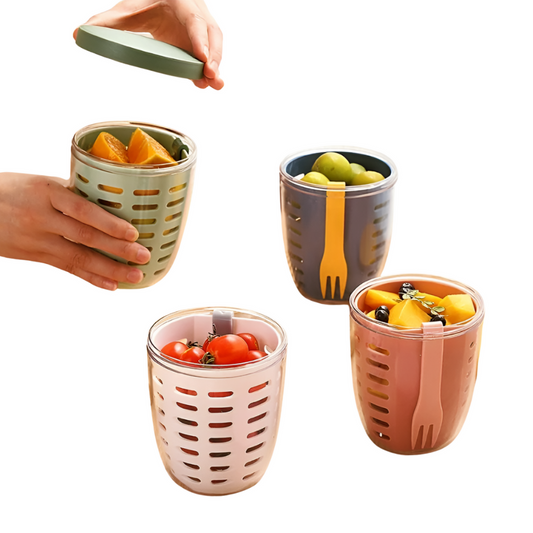 Four colorful snack cups with fruit and vegetables on a white background