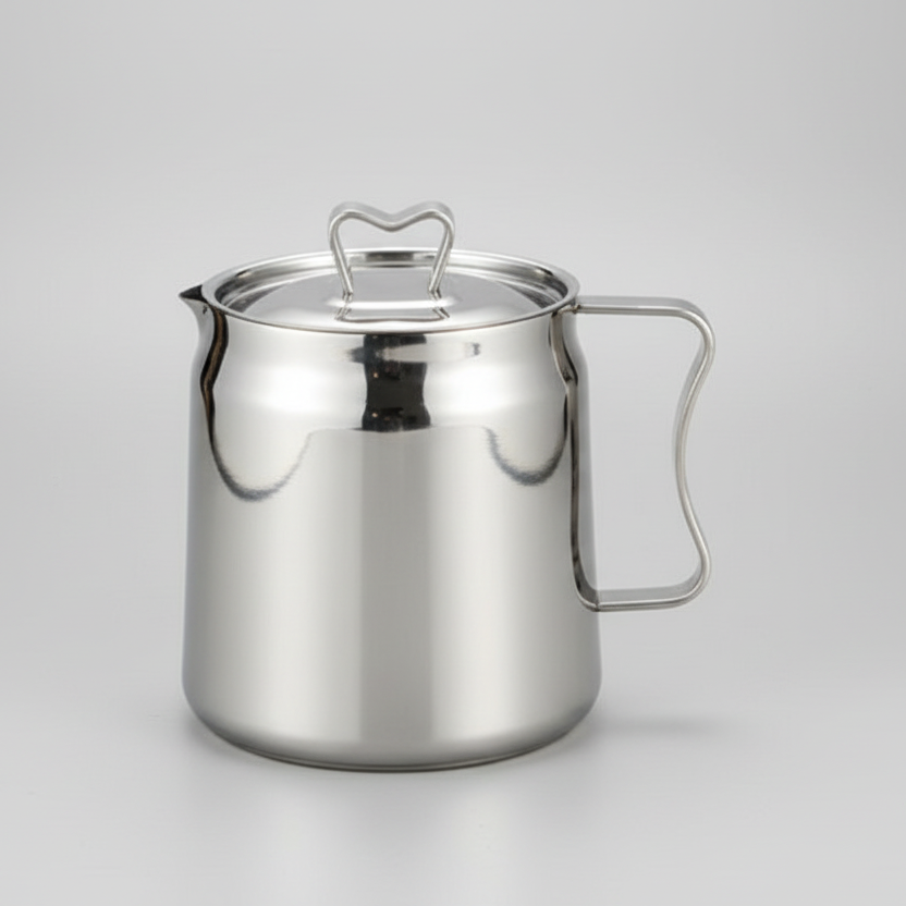 Stainless steel pitcher on a gray background