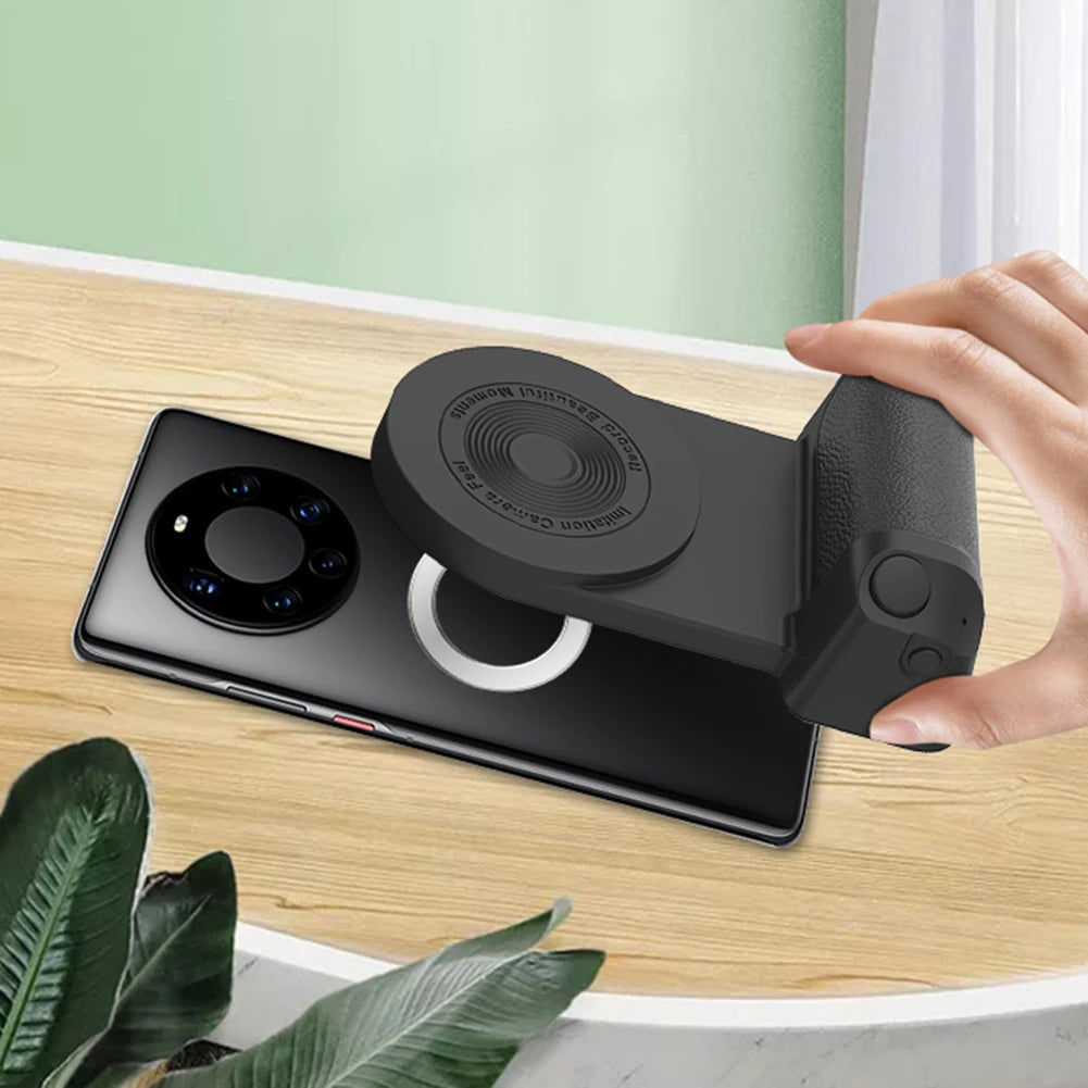 Phone case with camera lens protector being held over a smartphone on a wooden surface.
