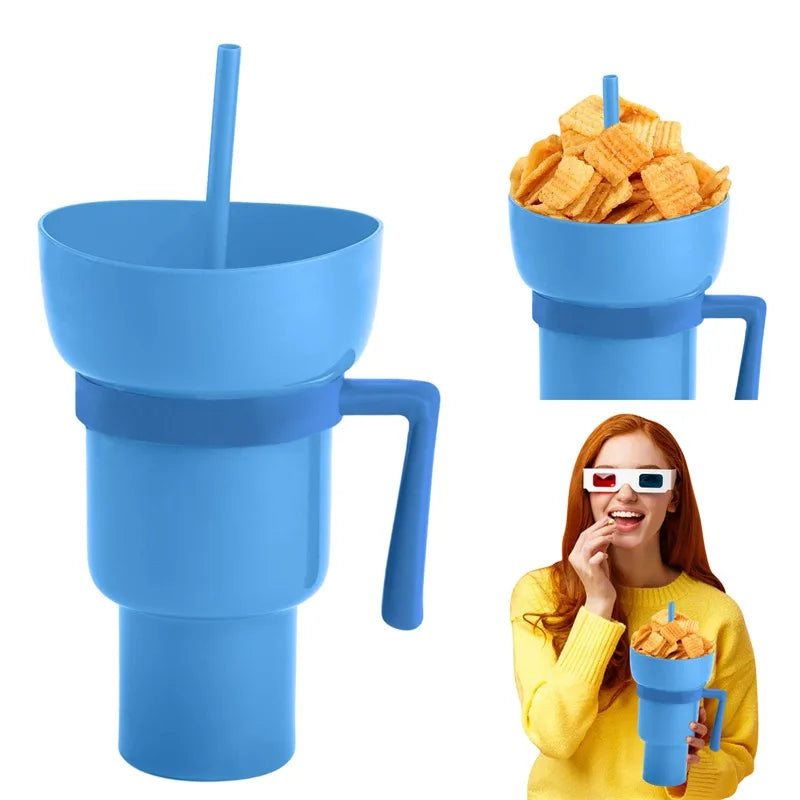 Blue snack cup with handle and straw, filled with chips, next to a person wearing 3D glasses.