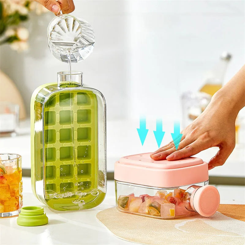 Green ice cube tray with clear liquid being poured into it, next to a pink container with ice cubes.
