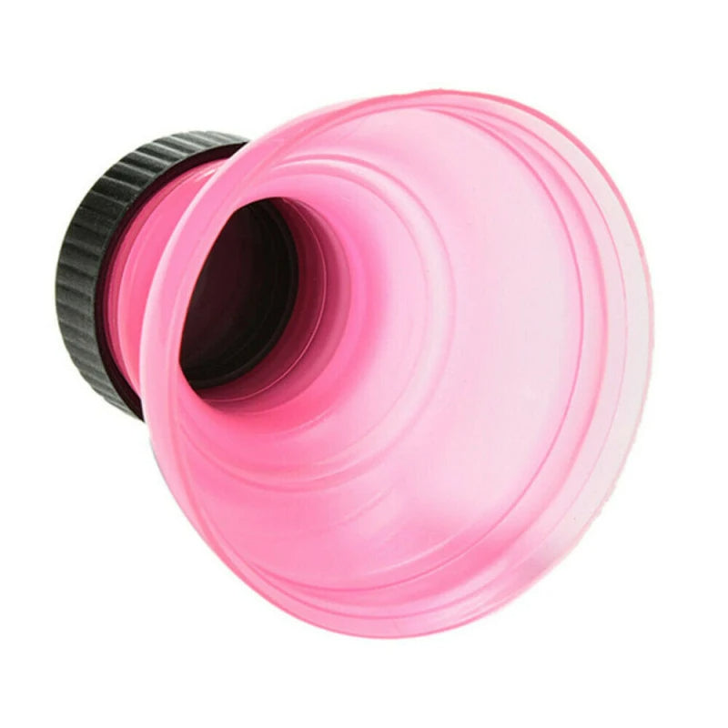 Pink and black garden hose nozzle on a white background