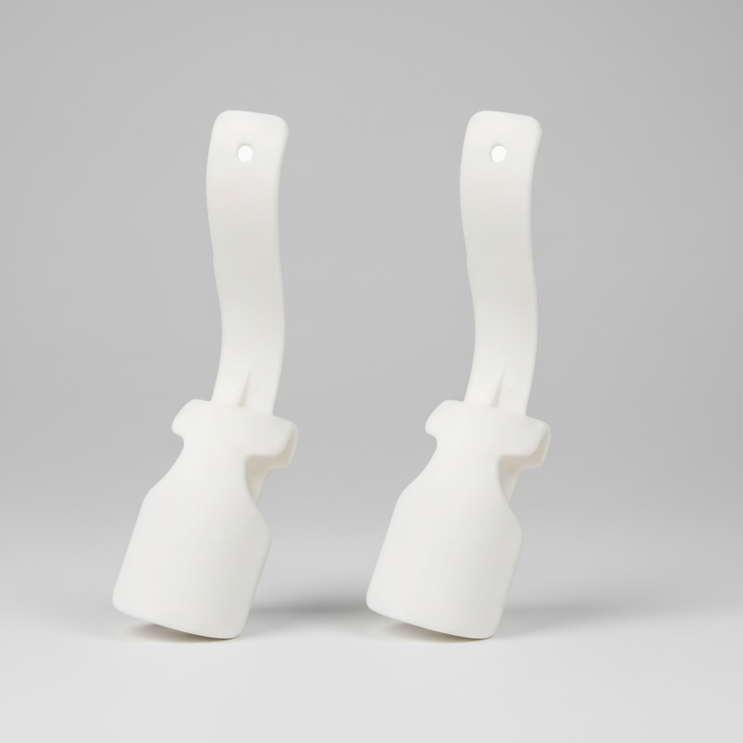Two white scrub brushes with handles on a white background
