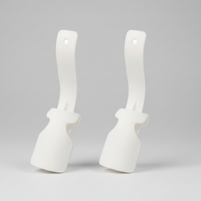 Two white scrub brushes with handles on a white background