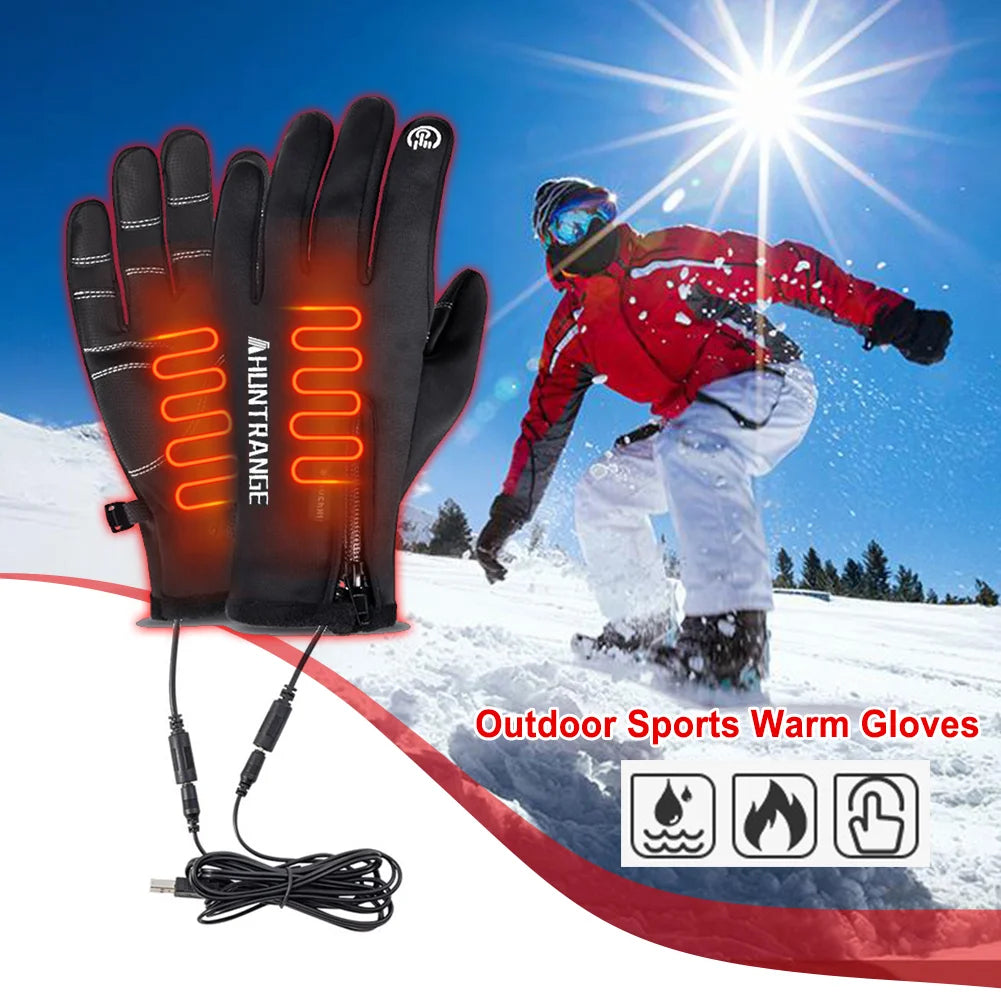Heated gloves with USB cable on a snowy background with a skier.