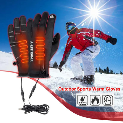 Heated gloves with USB cable on a snowy background with a skier.