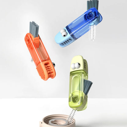 Three colorful cleaning brushes on a white background