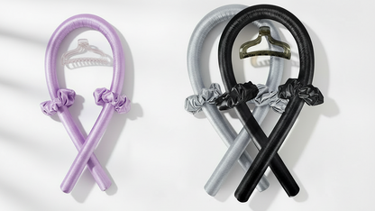Set of colorful hair ties with clips on a white background