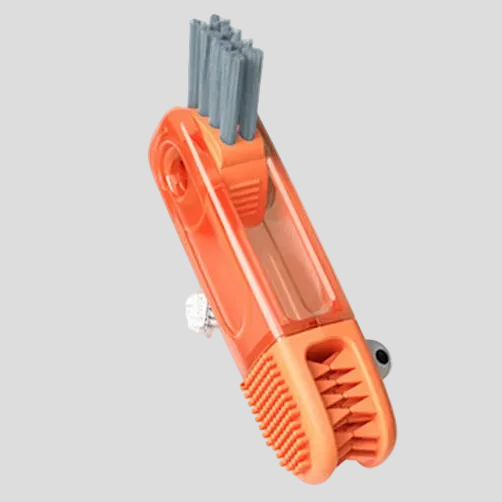 Orange grooming tool with bristles on a white background