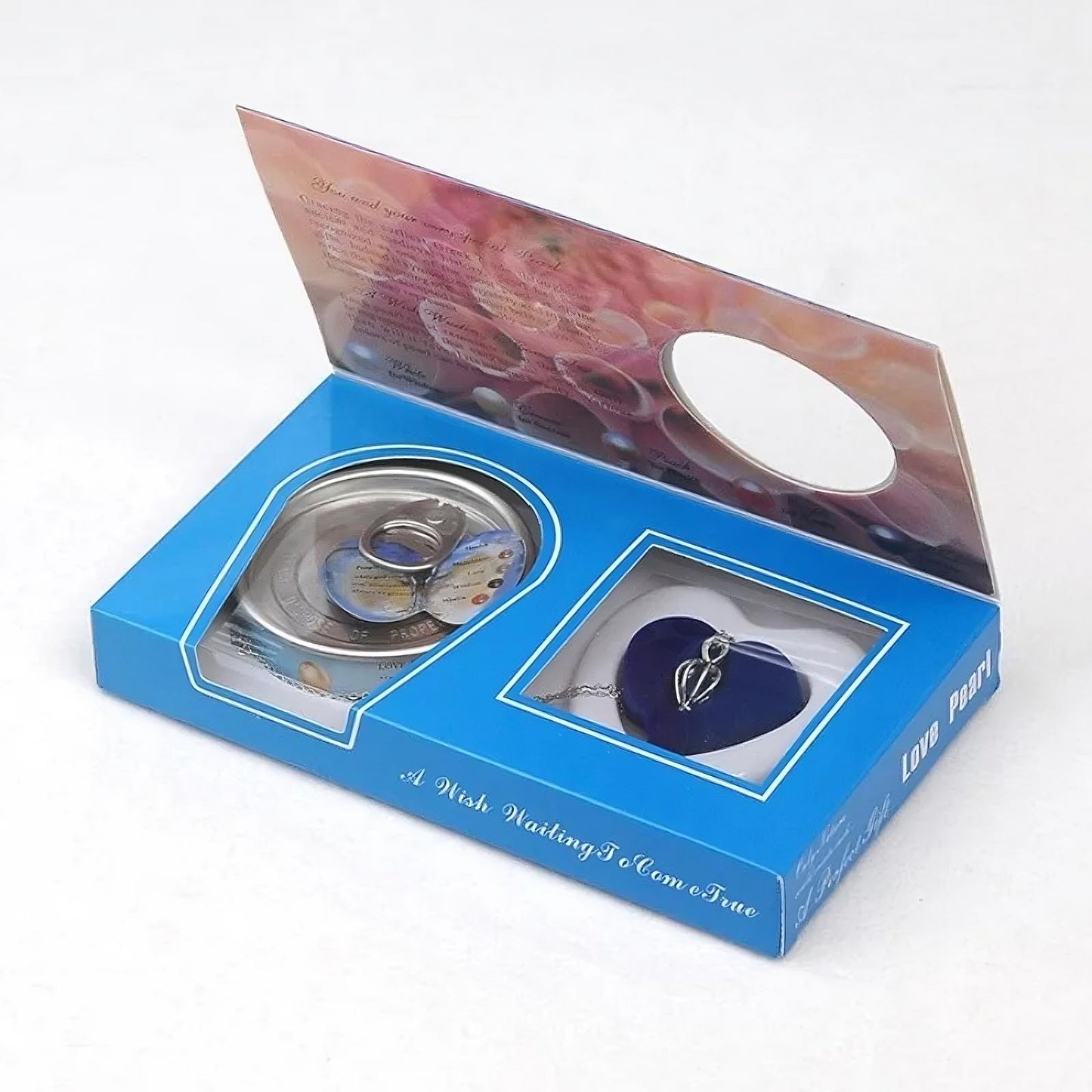 Blue jewelry box with heart-shaped pendant and decorative elements on a white background
