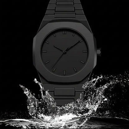 Black watch with water splashing around it on a black background