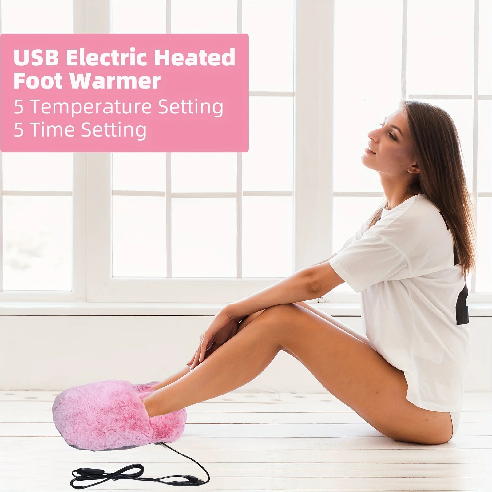 Woman using a USB electric heated foot warmer in a bright room.