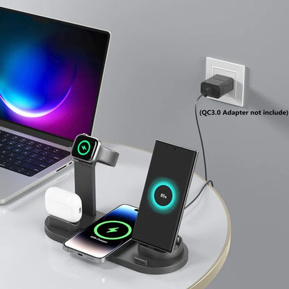 Multi-device wireless charging stand with laptop, phone, watch, and airpods on a desk.