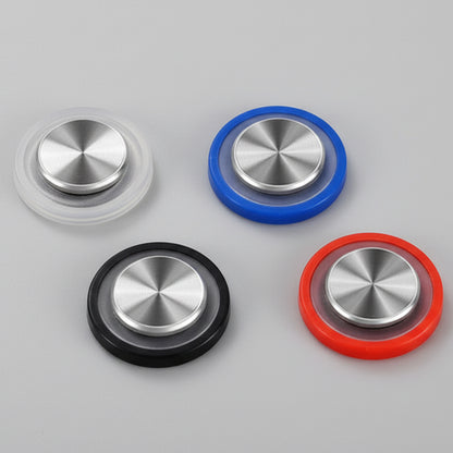 Set of colorful metal buttons with a black textured background