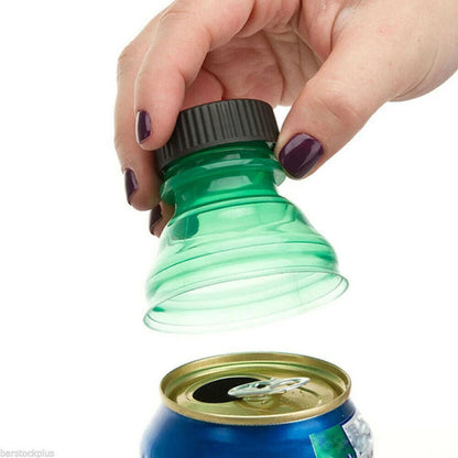 Hand using a green bottle cap opener on a white background