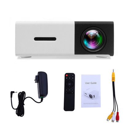 FlixeMatix White Laser Projector with accessories including a power cable, remote control, user guide, and audio cables on a white background.