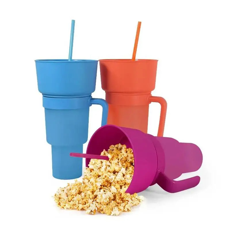 Colorful popcorn buckets with straws on a white background