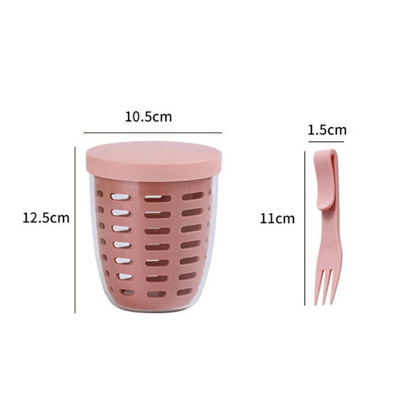 Pink container with lid and fork, showing measurements on a white background