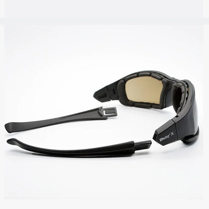 Black sunglasses with beige lenses on a white background