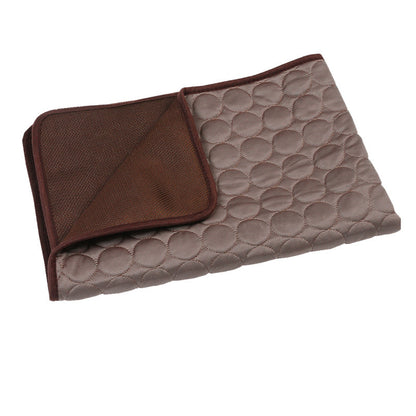 Quilted blanket with brown border on a white background