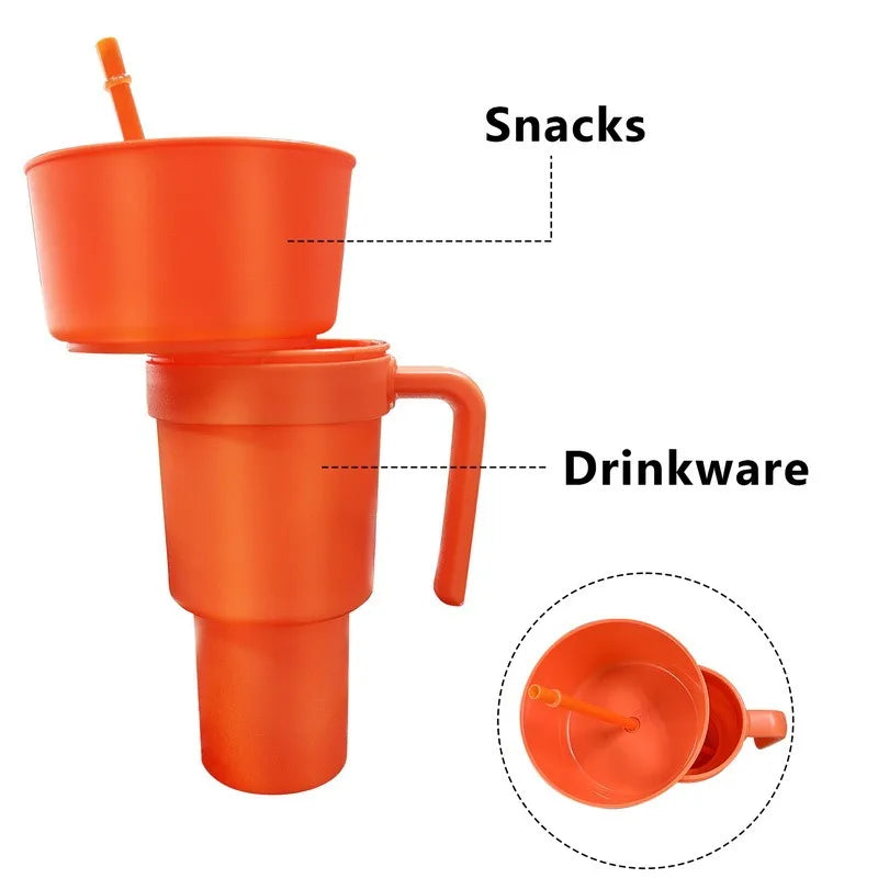 Orange cup with lid and straw, labeled 'Snacks' and 'Drinkware', on a white background.