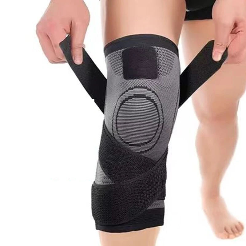 Knee brace being worn on a person's leg with a white background