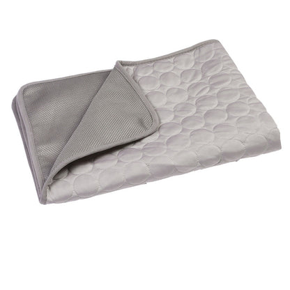 Gray quilted blanket with textured surface on a white background