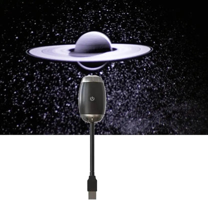 Small device with a USB cable against a space-themed background