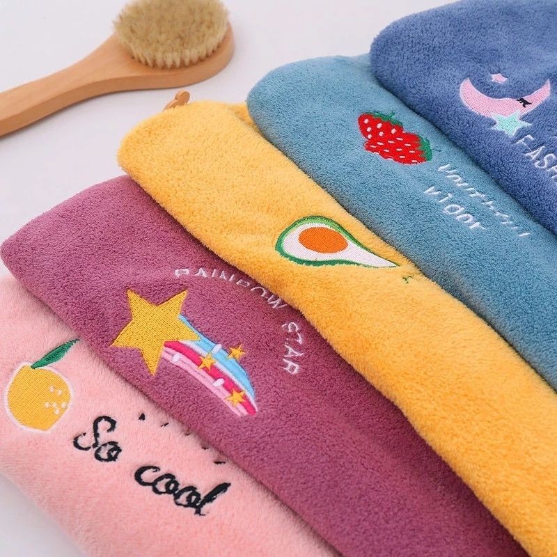 Set of colorful towels with cartoon designs on a white background