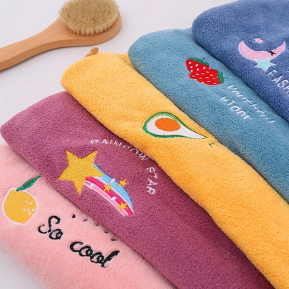 Set of colorful towels with cartoon designs on a white background