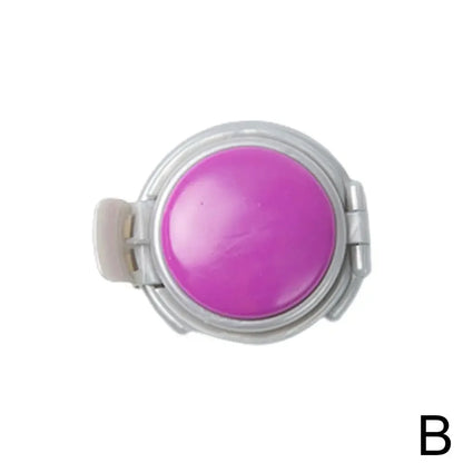 Purple circular object with a white border on a white background