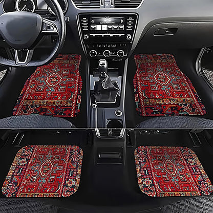 Car interior with red patterned floor mats on a black background