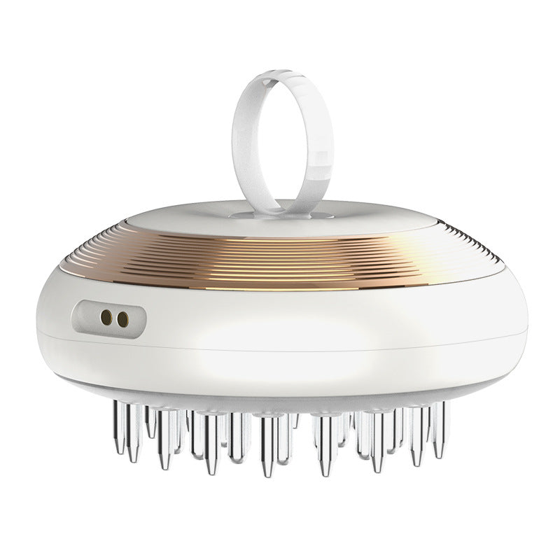 White and gold scalp massager on a white background