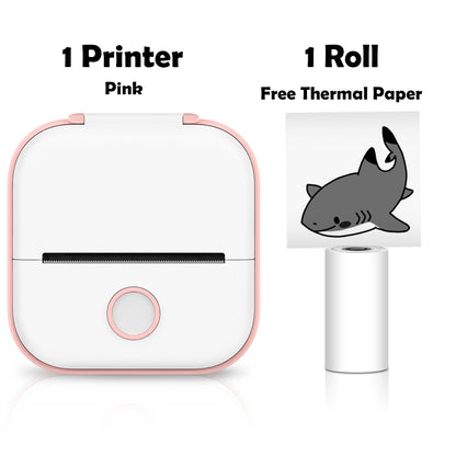 Pink printer with a roll of thermal paper featuring a shark design on a white background.