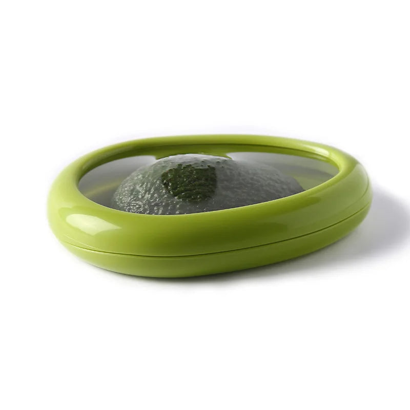 Green container with an avocado inside on a white background