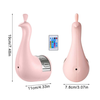 Pink peacock-shaped night light projectior with remote control and measurements on a white background