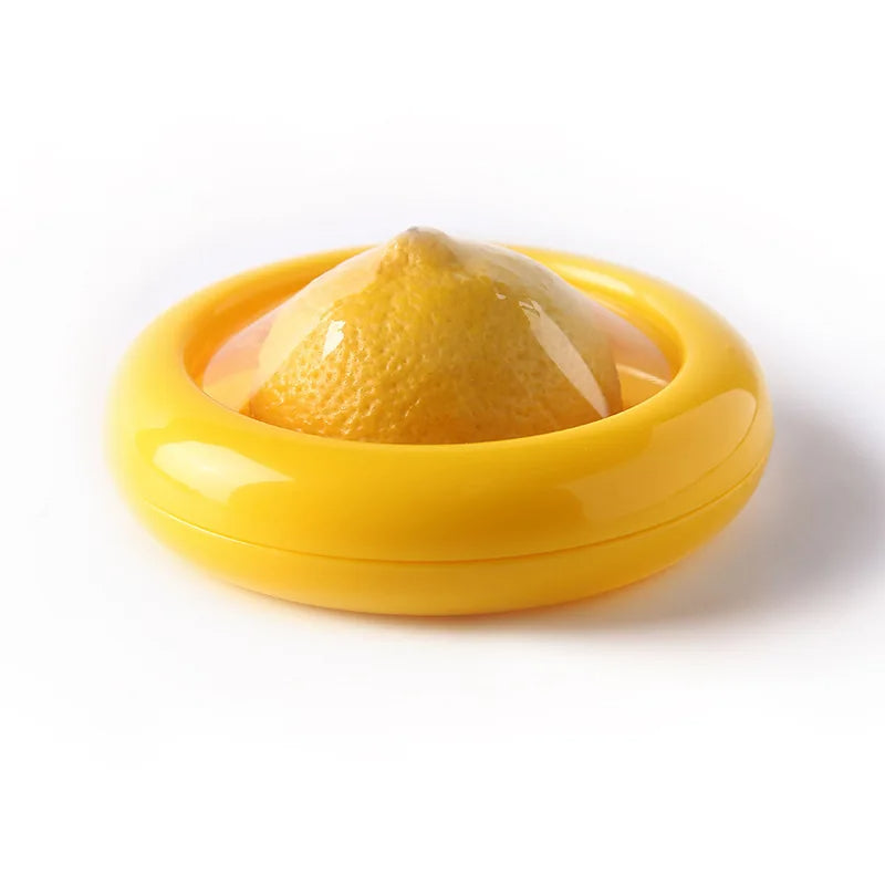 Yellow lemon squeezer with a lemon inside on a white background