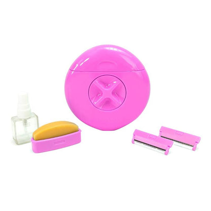 Set of pink kitchen tools including a round container, peeler, and other accessories on a white background
