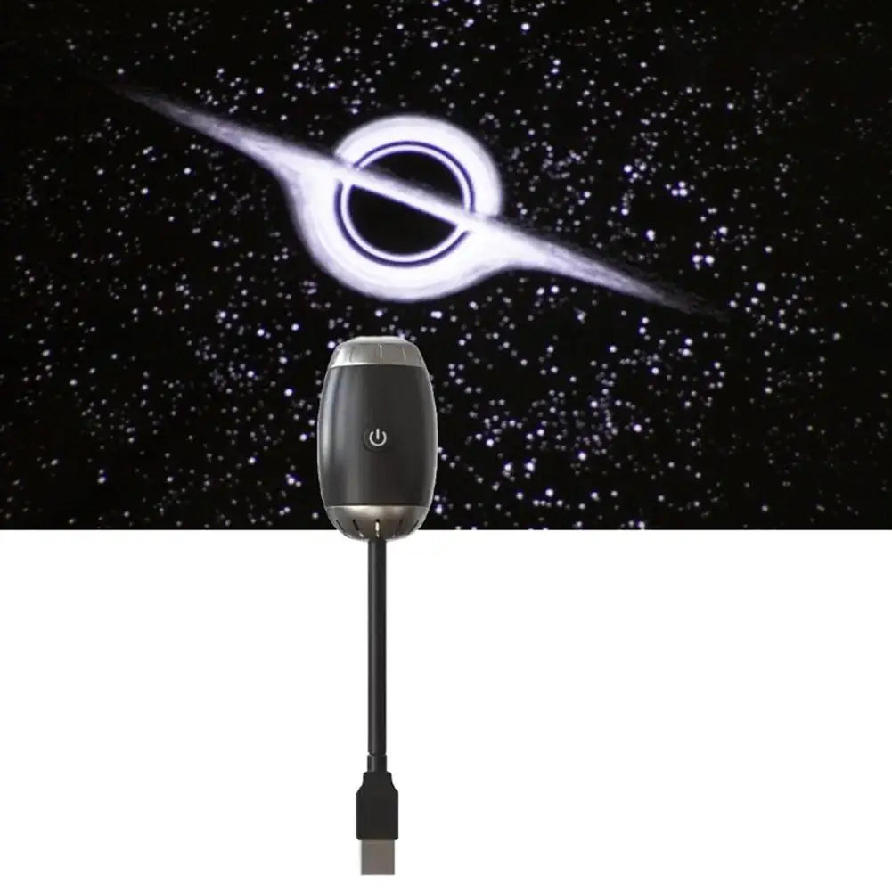 Black electronic device with USB cable against a space-themed background
