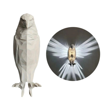 Decorative wall art of a bird with a close-up inset showing light effect.