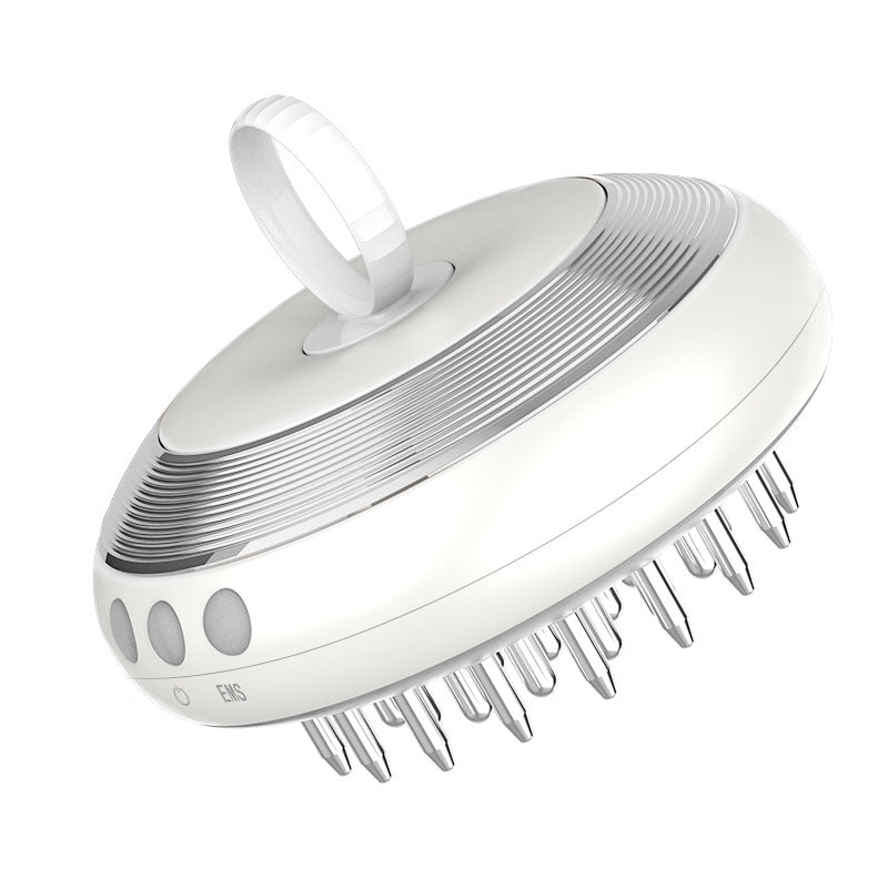 White scalp massager with comb-like design on a white background